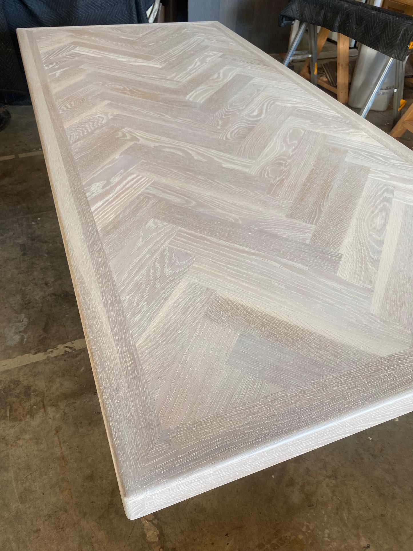 Whitewash Artisan Dining Table - Herringbone Design With Modern Metal Pedestal Base