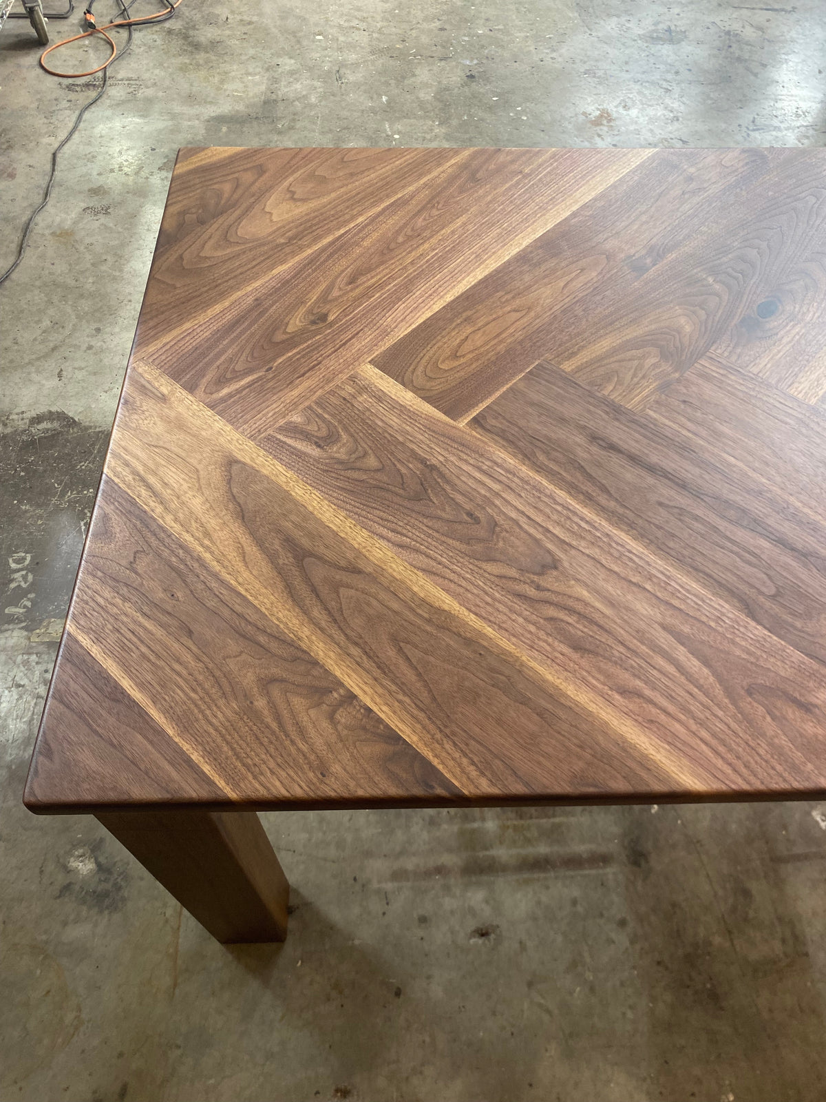 Walnut Herringbone Dining Room Table with Parsons Style Base