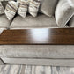 Handmade ottoman table top tray sitting on a clients grey fabric ottoman