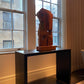Black console table holding a sculpture in manhattan new york, handmade in america