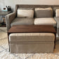 wood ottoman table sitting over customers fabric ottoman