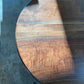 one of a kind round dining table with natural walnut slab slab made in columbus ohio, tulip base, gloss black tulip base, walnut live edge, walnut slab, walnut dining table, hardwood dining table, handmade dining table in ohio, made in use, made in america, local business, small business, luxury furniture, bespoke furniture, walnut in the sun, figured walnut grain, beautiful rays curls 