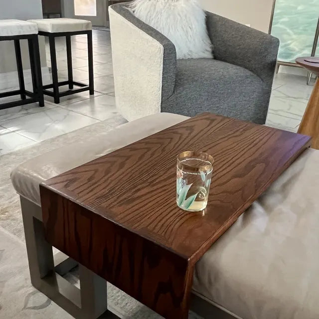 Wooden ottoman tray fitted to a cream leather ottoman with metal legs