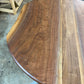one of a kind round dining table with natural walnut slab slab made in columbus ohio, tulip base, gloss black tulip base, walnut live edge, walnut slab, walnut dining table, hardwood dining table, handmade dining table in ohio, made in use, made in america, local business, small business, luxury furniture, bespoke furniture, walnut in the sun, figured walnut grain, beautiful rays curls 