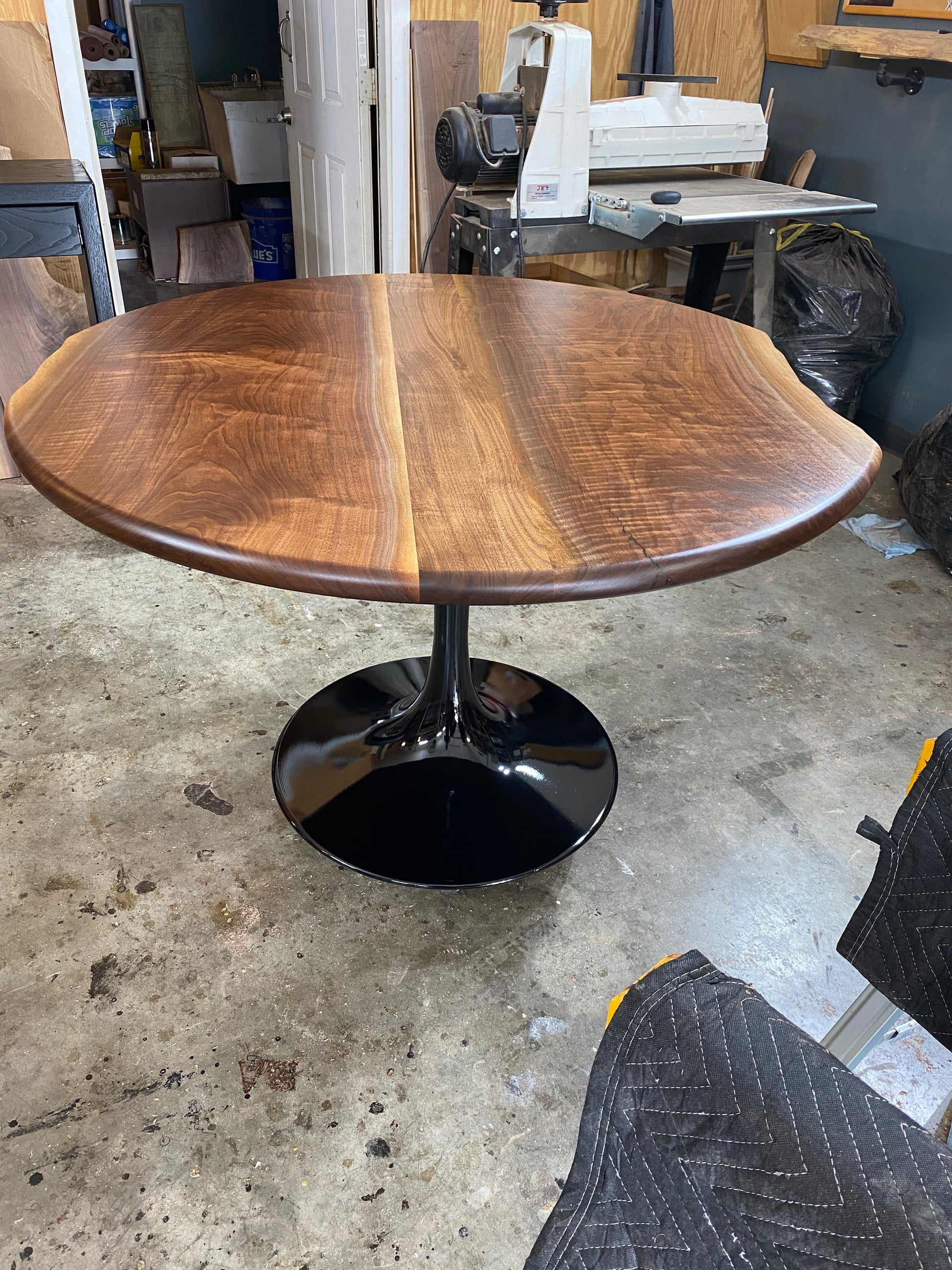 one of a kind round dining table with natural walnut slab slab made in columbus ohio, tulip base, gloss black tulip base, walnut live edge, walnut slab, walnut dining table, hardwood dining table, handmade dining table in ohio, made in use, made in america, local business, small business, luxury furniture, bespoke furniture