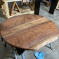 one of a kind round dining table with natural walnut slab slab made in columbus ohio, tulip base, gloss black tulip base, walnut live edge, walnut slab, walnut dining table, hardwood dining table, handmade dining table in ohio, made in use, made in america, local business, small business, luxury furniture, bespoke furniture, walnut in the sun, figured walnut grain, beautiful rays curls 