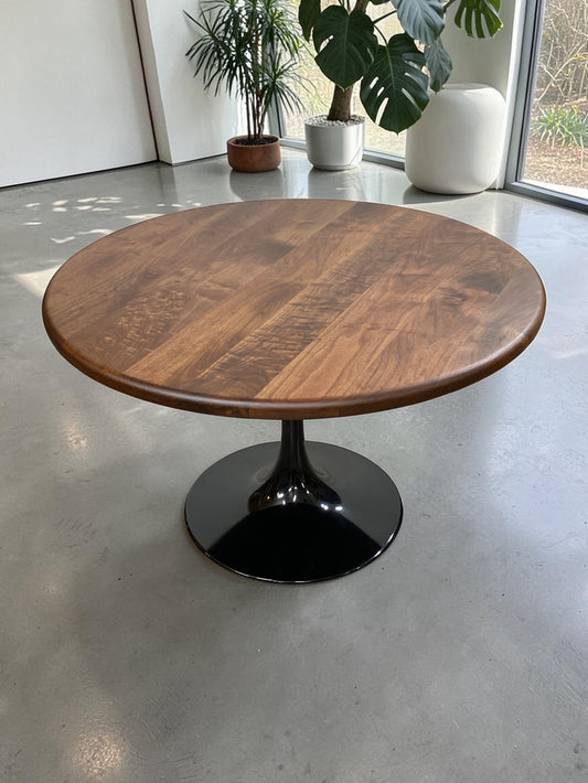 walnut wood round dining table with black metal tulip base, handmade in USA, made in america, made in ohio, solid walnut dining table with pedestal base