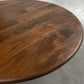 walnut wood round dining table with black metal tulip base, handmade in USA, made in america, made in ohio, solid walnut dining table with pedestal base, walnut table top closeup 