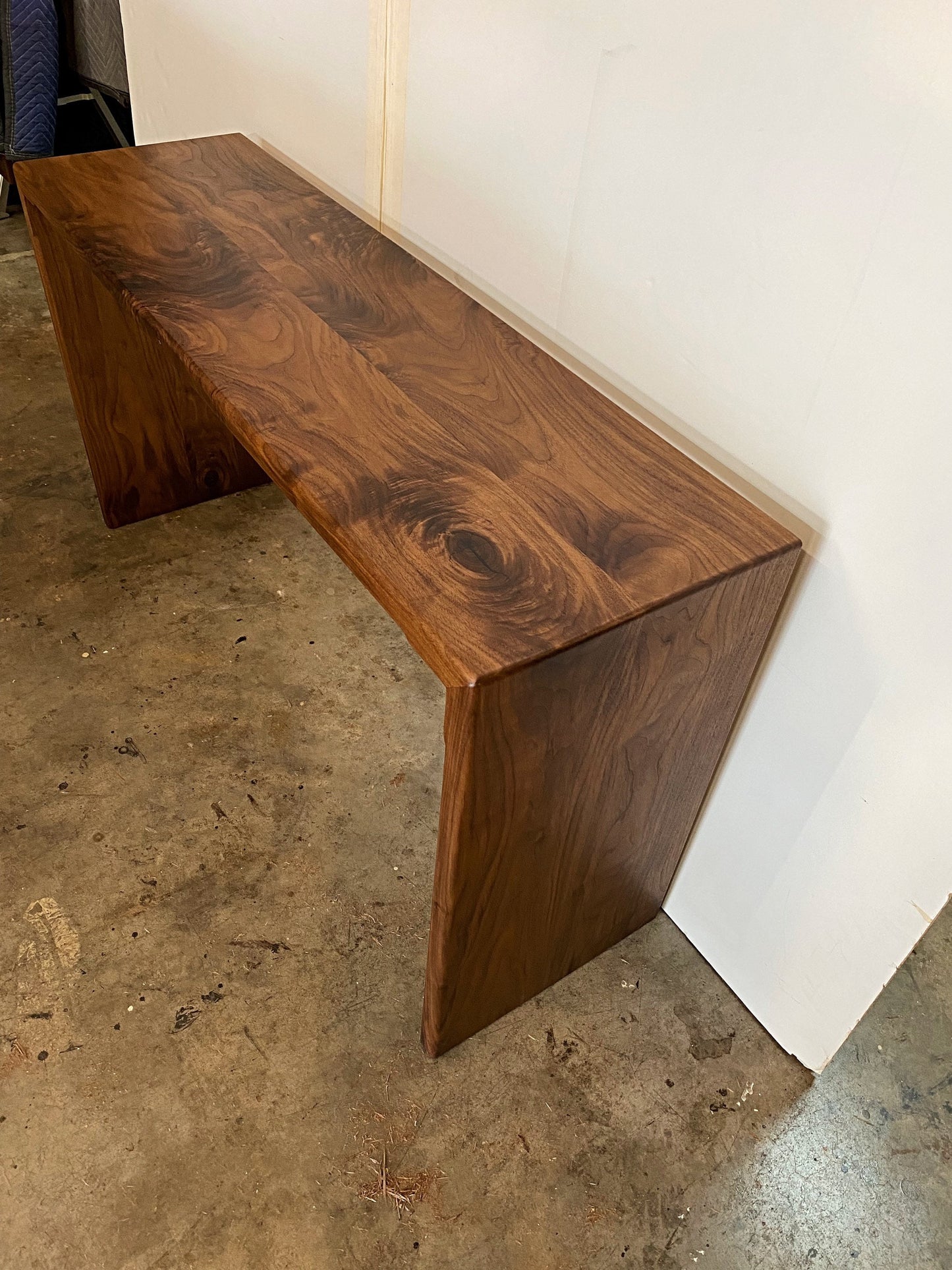 Hand made wood console table or entryway table in walnut with a modern waterfall design
