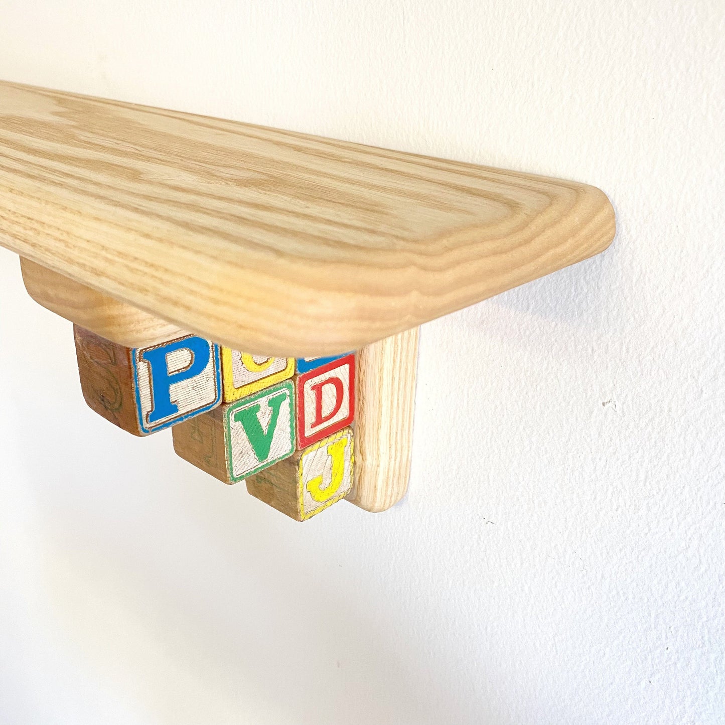 Fun & Colorful Nursery Shelf Made with Vintage Letter Blocks