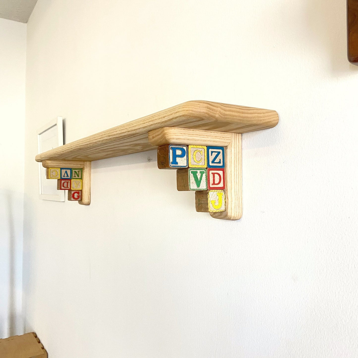 Fun & Colorful Nursery Shelf Made with Vintage Letter Blocks