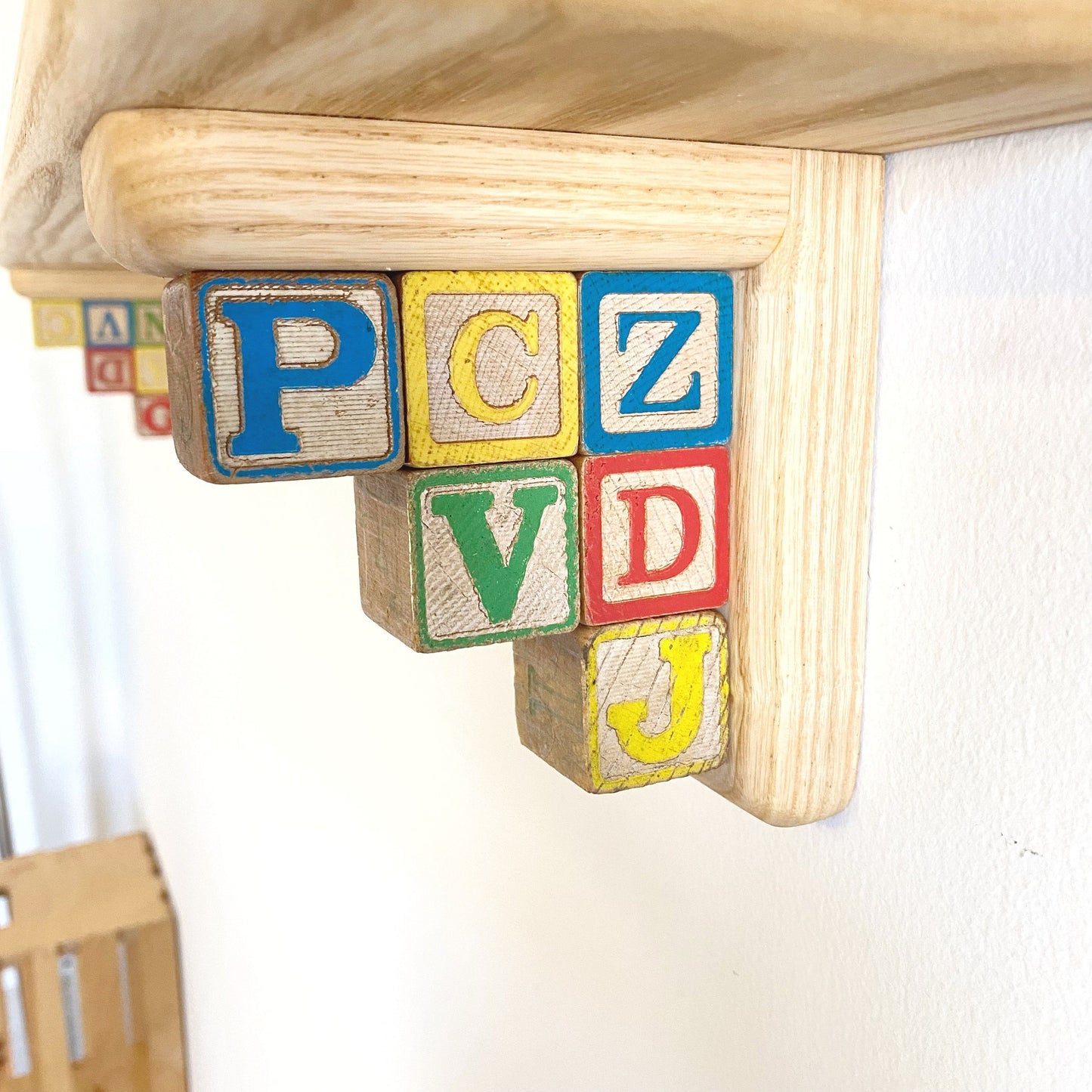 Fun & Colorful Nursery Shelf Made with Vintage Letter Blocks